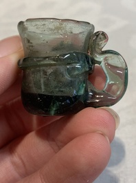 A Dutch or German green glass reliquary holder, excavated in Maastricht, 16/17th C.