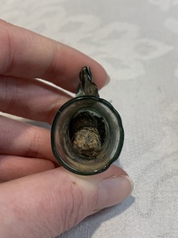 A Dutch or German green glass reliquary holder, excavated in Maastricht, 16/17th C.