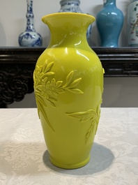 A pair of Chinese yellow Peking glass vases with peonies and a bird, 20th C.