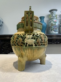 A Chinese sancai-glazed reticulated double-walled tripod censer and cover, Ming