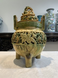 A Chinese sancai-glazed reticulated double-walled tripod censer and cover, Ming