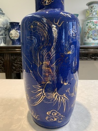 A Chinese gilt-decorated powder-blue 'dragon and phoenix' rouleau vase, 19th C.