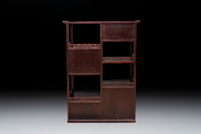 A Chinese carved wooden cabinet with chilong design, 20th C.