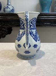 A Chinese blue and white jug with floral design, Kangxi