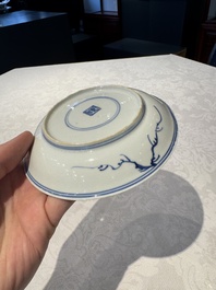 Two Chinese blue and white cups and saucers, Kangxi/Yongzheng