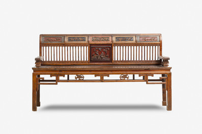 A Chinese carved and lacquered wooden bench, 19th C.