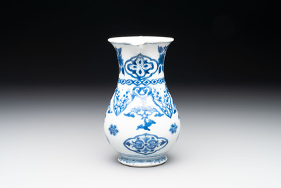 A Chinese blue and white jug with floral design, Kangxi