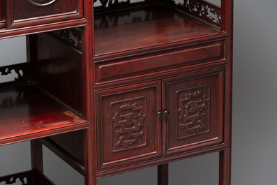 A Chinese carved wooden cabinet with chilong design, 20th C.