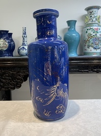 A Chinese gilt-decorated powder-blue 'dragon and phoenix' rouleau vase, 19th C.