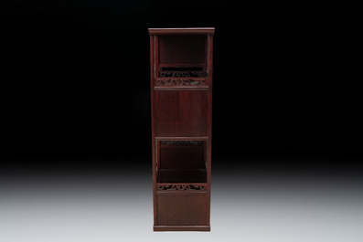 A Chinese carved wooden cabinet with chilong design, 20th C.