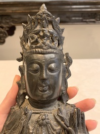 A Chinese bronze seated Guanyin, Ming