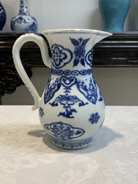 A Chinese blue and white jug with floral design, Kangxi
