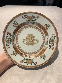 A pair of Chinese armorial monogrammed plates and a famille rose plate, Kangxi/Yongzheng