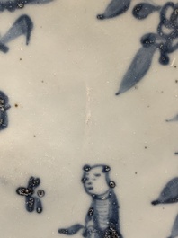 A Chinese Swatow blue and white 'lady and a boy' dish, Ming