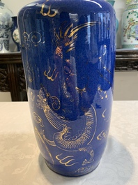 A Chinese gilt-decorated powder-blue 'dragon and phoenix' rouleau vase, 19th C.