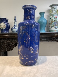 A Chinese gilt-decorated powder-blue 'dragon and phoenix' rouleau vase, 19th C.