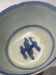 Two Chinese blue and white cups and saucers, Kangxi/Yongzheng