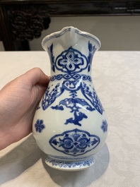 A Chinese blue and white jug with floral design, Kangxi