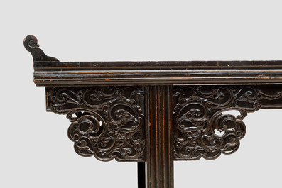 A massive Chinese red-and-black-lacquered altar table, 'qiaotouan', Qing