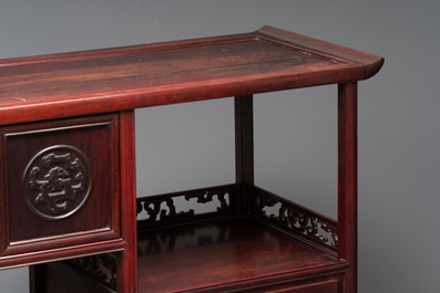 A Chinese carved wooden cabinet with chilong design, 20th C.