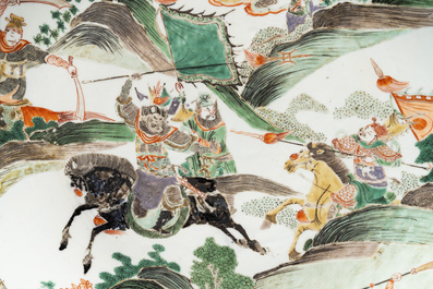 A Chinese famille verte 'warriors on horseback' dish, lingzhi mark, Kangxi