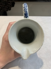 A Chinese blue and white jug with floral design, Kangxi