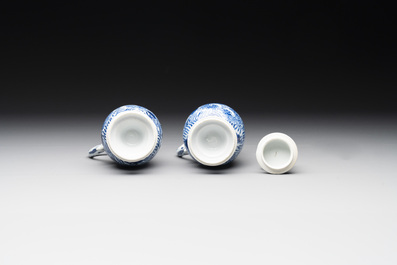 A pair of Chinese blue and white jugs and covers with floral design, Kangxi
