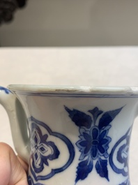 A Chinese blue and white jug with floral design, Kangxi