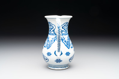 A Chinese blue and white jug with floral design, Kangxi