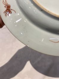 A pair of Chinese armorial monogrammed plates and a famille rose plate, Kangxi/Yongzheng