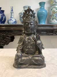 A Chinese bronze seated Guanyin, Ming