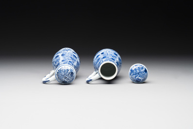A pair of Chinese blue and white jugs and covers with floral design, Kangxi