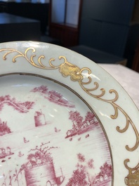 A Chinese puce-enamelled and gilt-decorated 'harbour scene' plate, Qianlong