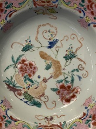 A pair of Chinese armorial monogrammed plates and a famille rose plate, Kangxi/Yongzheng