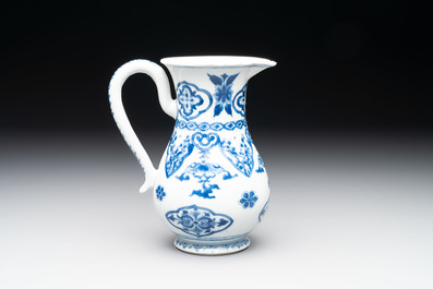 A Chinese blue and white jug with floral design, Kangxi