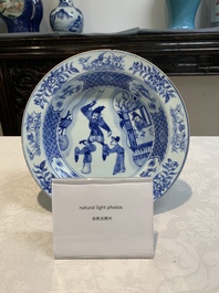 A pair of Chinese blue and white 'dragon' plates and a plate with narrative design, Yuzhen mark, Kangxi/Yongzheng