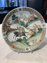 A Chinese famille verte 'warriors on horseback' dish, lingzhi mark, Kangxi