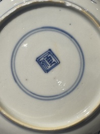 Two Chinese blue and white cups and saucers, Kangxi/Yongzheng