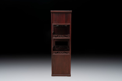 A Chinese carved wooden cabinet with chilong design, 20th C.