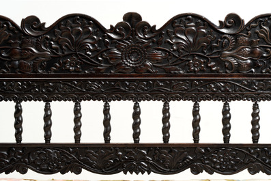 A Dutch colonial carved and ebonized wooden bench, 18th C.