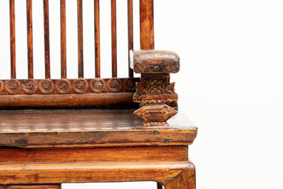 A Chinese carved and lacquered wooden bench, 19th C.
