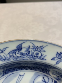 A pair of Chinese blue and white 'dragon' plates and a plate with narrative design, Yuzhen mark, Kangxi/Yongzheng