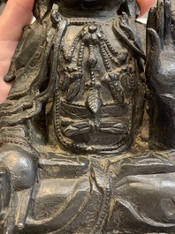 A Chinese bronze seated Guanyin, Ming