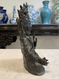 A Chinese bronze seated Guanyin, Ming