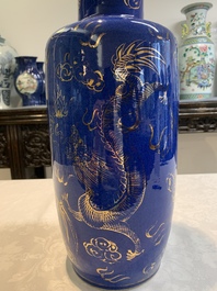 A Chinese gilt-decorated powder-blue 'dragon and phoenix' rouleau vase, 19th C.