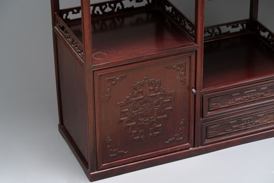 A Chinese carved wooden cabinet with chilong design, 20th C.