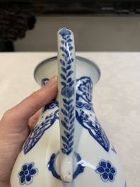 A Chinese blue and white jug with floral design, Kangxi