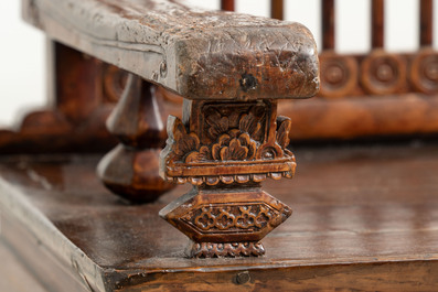 A Chinese carved and lacquered wooden bench, 19th C.