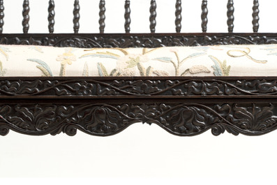 A Dutch colonial carved and ebonized wooden bench, 18th C.