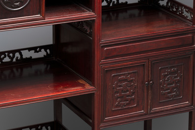 A Chinese carved wooden cabinet with chilong design, 20th C.